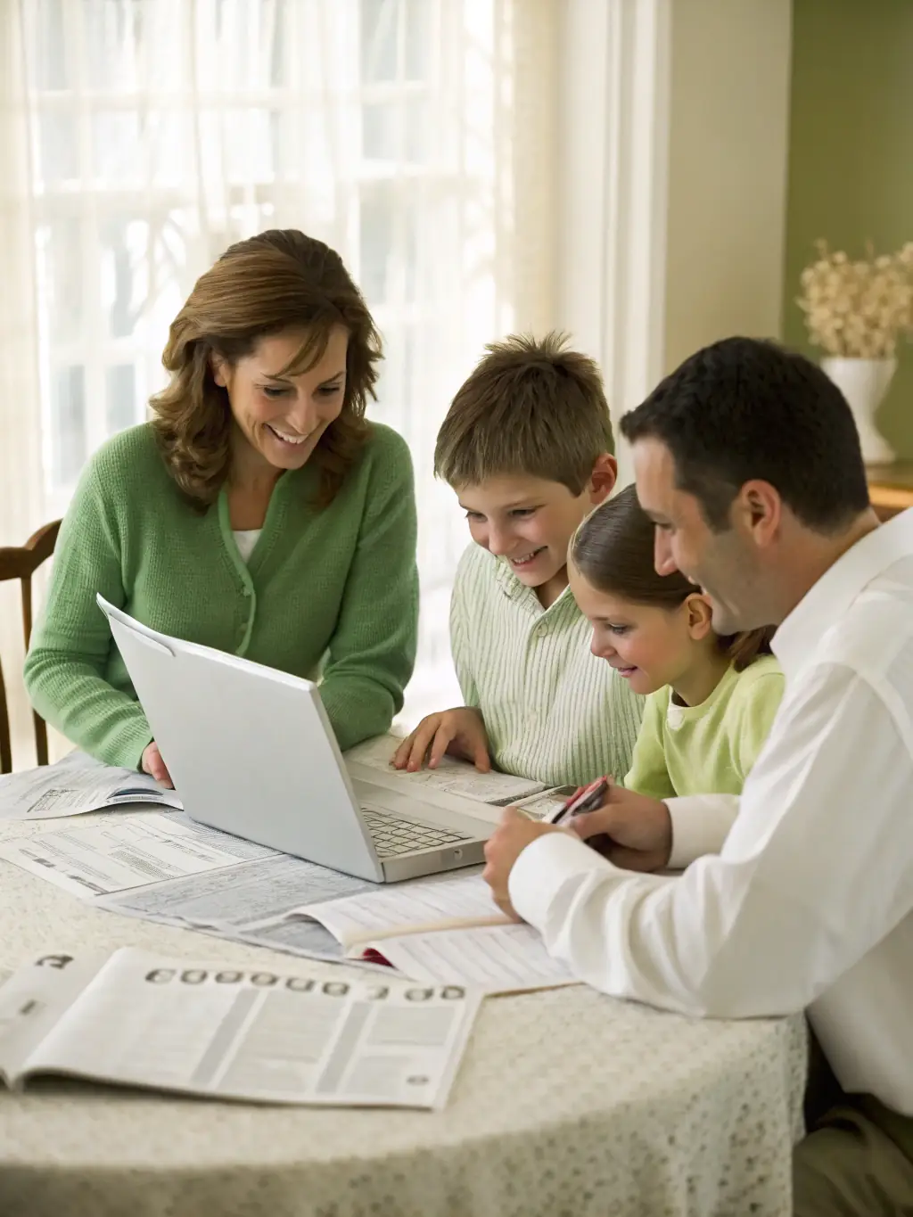 A family sitting around a table, reviewing their finances with a financial advisor, highlighting the collaborative nature of family budgeting.